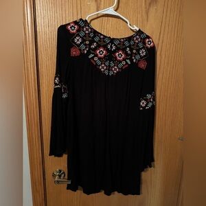black dress with flowers around the neck and wrists from francesca’s